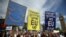 FILE - Protestors hold banners in London's Parliament Square during a 'March for Europe' demonstration against Britain's decision to leave the European Union, July 2, 2016. 
