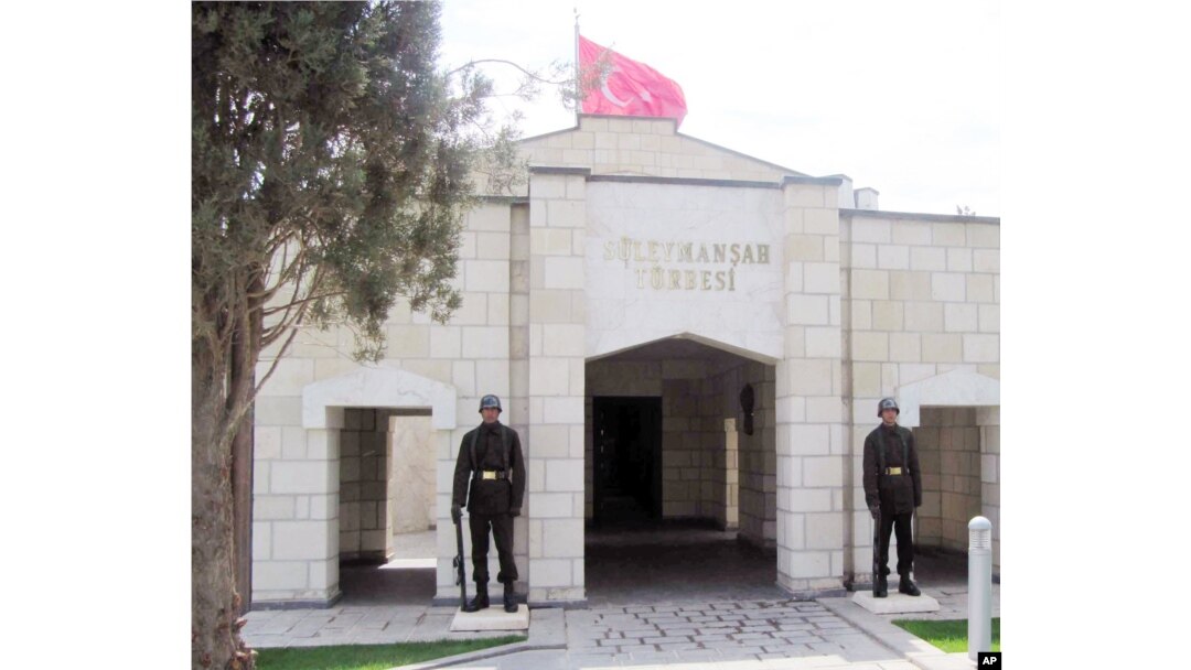 FILE - Turkish soldiers stand guard at the entrance to the memorial site of Suleyman Shah, grandfather of Osman I, founder of the Ottoman Empire, in Karakozak village, northeast of Aleppo, Syria, April 2011.
