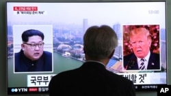 A man watches a TV screen showing file footage of President Trump, right, and North Korean leader Kim Jong Un at the Seoul Railway Station in Seoul, South Korea, May 16, 2018.