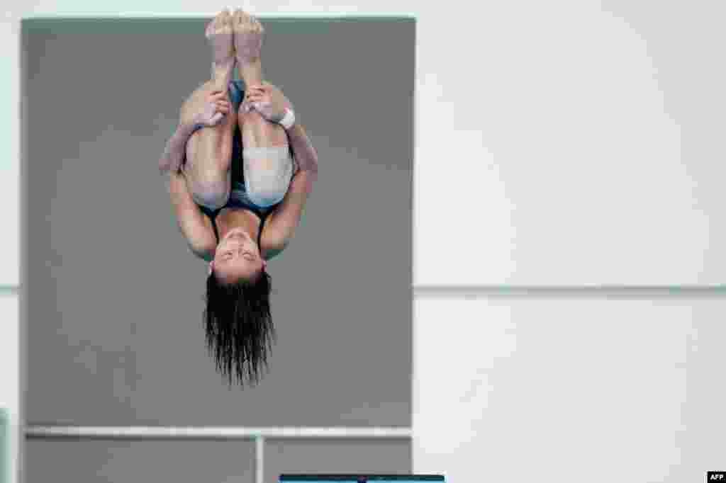 Singapore&#39;s Fong Kay Yian competes during the women&#39;s three-meter springboard diving event at the 27th SEA Games in Naypyidaw, Burma.