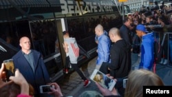 Justin Bieber is pictured boarding his tour bus outside Grand Hotel for his concert in Stockholm, Apr. 23, 2013.
