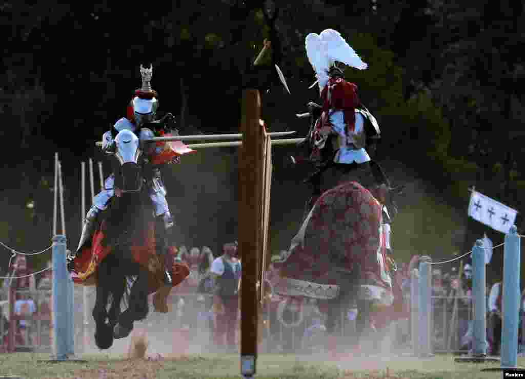 Australian jouster Phillip Leitch (L) competes against Frenchman Michael Sadde on the way to Leitch winning the inaugural World Jousting Championship at the St. Ives Medieval Faire in Sydney, Australia.