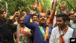 There were raucous celebrations outside Bharatiya Janata Party headquarters as news of the party's huge win in Uttar Pradesh came in on Saturday, in New Delhi, India, March 11, 2017. (A. Pasricha/VOA).