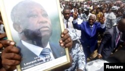 FILE - Aboudramane Sangare of the Ivorian Popular Front (FPI) arrives for a rally of the opposition National Coalition for Change (CNC) in Koumassi, a district of Abidjan, June 27, 2015. 