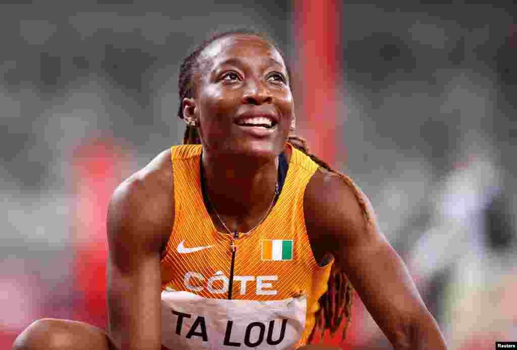 Marie Josee Ta Lou da Costa do Marfim reage depois de competir. REUTERS/Lucy Nicholson