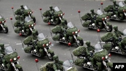 Taiwan’s military police perform during the National Day in front of the Presidential Office in Taipei on Oct. 10, 2020.