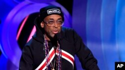 Spike Lee presents the award for best director at the 33rd Film Independent Spirit Awards in Santa Monica, California, March 3, 2018. Lee's "BlacKkKlansman" will open in theaters on Aug. 10, the one-year anniversary of the violent protests in Charlottesville, Virginia, where white nationalists marched and a protester was killed