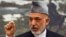 Afghan President Hamid Karzai speaks during a news conference in Kabul, June 12, 2012. 