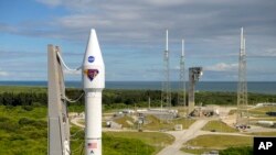 In this image released by NASA, a United Launch Alliance Atlas V rocket with the Lucy spacecraft aboard is rolled out of the Vertical Integration Facility to the launch pad at Space Launch Complex 41, in Cape Canaveral, Fla., Oct. 14, 2021. 