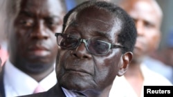 FILE: Zimbabwe President Robert Mugabe addresses supporters outside ZANU-PF headquarters, Harare, Oct. 30, 2014.