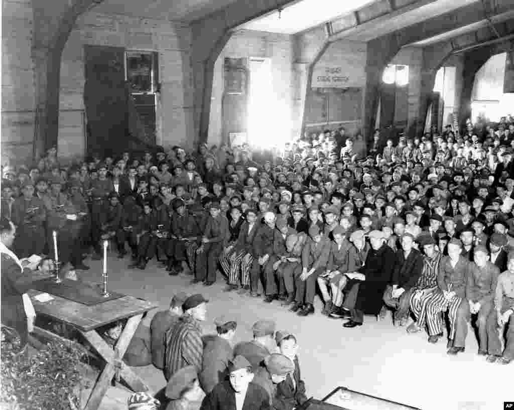 Chaplain Hershel Schacter conducts religious services at the liberated Buchenwald concentration camp in 1945. (Photo courtesy Jewish Chaplains Council)