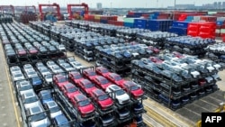 FILE - The file photo taken on Sept. 11, 2023 shows BYD electric cars waiting to be loaded on a ship stacked at the international container terminal of Taicang Port at Suzhou Port, in China’s eastern Jiangsu Province.