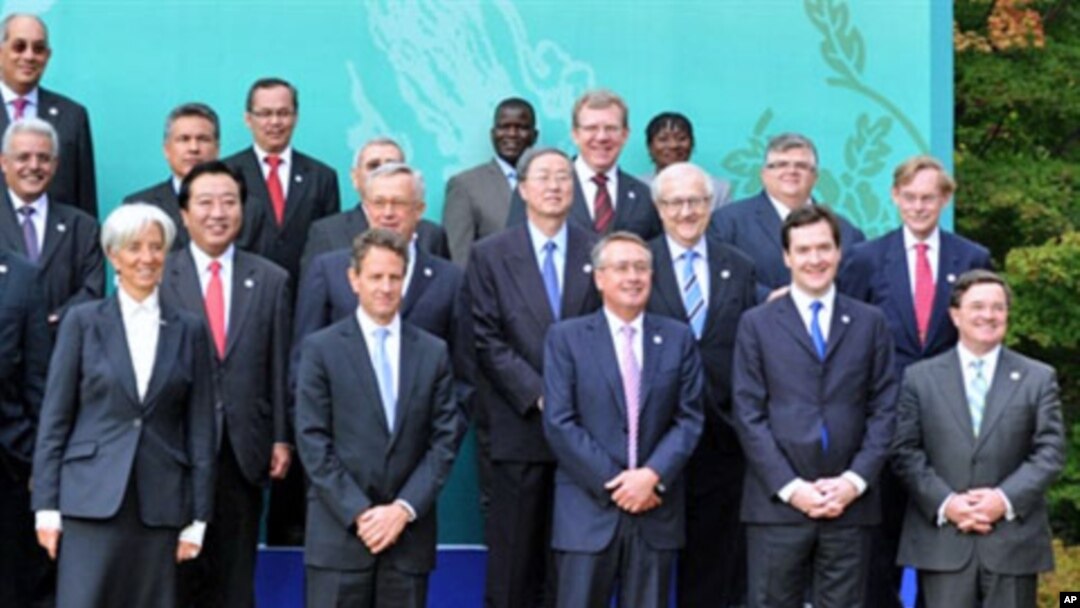 (L-R front row) France's Economy Minister Christine Lagarde, US Treasury Secretary Timothy Geithner, Australia's treasurer Wayne Swan, UK Chancellor of the Exchequer George Osborne, Canada Finance minister Jim Flaherty pose for a group photo at the G20 Fi