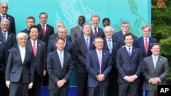 (L-R front row) France's Economy Minister Christine Lagarde, US Treasury Secretary Timothy Geithner, Australia's treasurer Wayne Swan, UK Chancellor of the Exchequer George Osborne, Canada Finance minister Jim Flaherty pose for a group photo at the G20 Fi