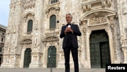 Italian opera singer Andrea Bocelli sings in an empty Duomo Square in Milan, Italy, on Easter Sunday, April 12, 2020. (Reuters File Photo/Alex Fraser)