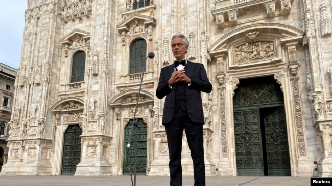 Italian opera singer Andrea Bocelli sings in an empty Duomo Square in Milan, Italy, on Easter Sunday, April 12, 2020. (Reuters File Photo/Alex Fraser)