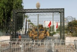 A military vehicle is parked in front of the parliament building in Tunis, Tunisia July 26, 2021.