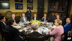 From the left: French President Francois Hollande, US President Barack Obama, British Prime Minister David Cameron, Russian Prime Minister Dmitry Medvedev, German Chancellor Angela Merkel, European Council president Herman van Rompuy, EU Commission presid