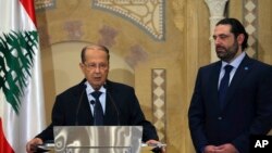 Midest Lebanon Presidential Elections Saad Hariri, stands next of Christian leader Michel Aoun