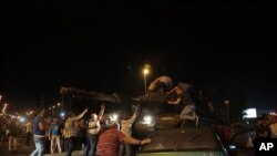 Tanks move into position as Turkish people attempt to stop them, in Ankara, Turkey, July 15, 2016. 