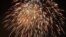 Fireworks are seen over the Washington Monument and Lincoln Memorial in Washington, July 4, 2012. (B. Allen/VOA)