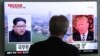 A man watches a TV screen showing file footage of President Trump, right, and North Korean leader Kim Jong Un at the Seoul Railway Station in Seoul, South Korea, May 16, 2018.