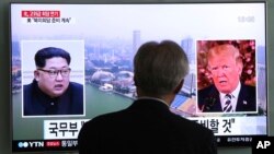 A man watches a TV screen showing file footage of President Trump, right, and North Korean leader Kim Jong Un at the Seoul Railway Station in Seoul, South Korea, May 16, 2018.