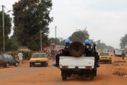 FILE - Soldiers of the U.N. force known by its French acronym MINUSCA are seen sitting on a vehicle in Bangui, Central African Republic, in this undated photo.