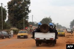 FILE - Soldiers of the U.N. force known by its French acronym MINUSCA are seen sitting on a vehicle in Bangui, Central African Republic, in this undated photo.