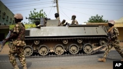 Nigerian troops patrol in the northeastern Nigeria city of Mubi — recaptured from Boko Haram in February — 20 kilometers (14 miles) west of the Cameroon border, March 9, 2015.