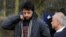 FILE - British businessman Shrien Dewani (L) and his father, Prakash Dewani, are seen heading to a bail hearing in London Feb. 24, 2011.
