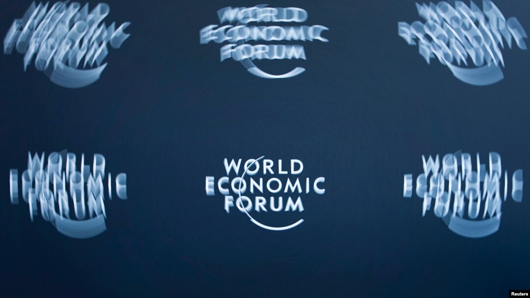 FILE - A logo, taken with long exposure, is shown at the World Economic Forum headquarters in Cologny near Geneva.