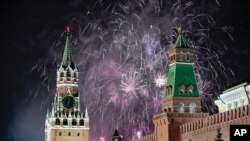 Crowds watch fireworks display during New Year's Eve celebrations in Brisbane, Australia, Dec. 31, 2019.