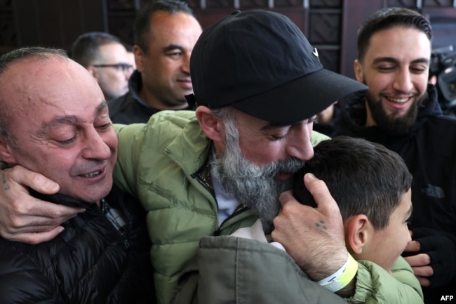 A former Palestinian prisoner, released as part of the sixth hostage-prisoner exchange, is welcomed by relatives upon arriving in the occupied West Bank city of Ramallah on Feb. 15, 2025.