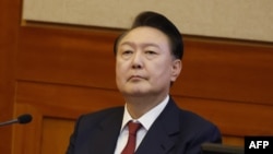 South Korea's impeached President Yoon Suk Yeol attends the fourth hearing of his impeachment trial over his short-lived imposition of martial law at the Constitutional Court in Seoul on Jan. 23, 2025. 