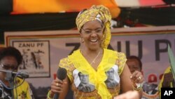 Zimbabwe's First Lady Grace Mugabe dances at a rally in Harare, Thursday, Nov. 19. 2015. (AP Photo/Tsvangirayi Mukwazhi)