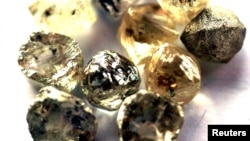 FILE PHOTO: Rough diamonds are displayed at the Botswana Diamond Valuing Company in Gaborone. Taken Aug. 26, 2004.