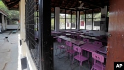 An empty classroom is seen inside a government run school after officials ordered to close down all schools and universities as a precautionary measure against COVID-19 in Colombo, Sri Lanka, Friday, March 13, 2020. (AP Photo/Eranga Jayawardena)
