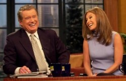 FILE - Regis Philbin laughs with co-host Kelly Ripa during a broadcast of "Live! with Regis and Kelly," Feb. 5, 2001, in New York.