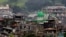 Damaged buildings and houses are seen as government forces continue their assault against insurgents from the Maute group, who have taken over large parts of Marawi city, Philippines, June 22, 2017. 