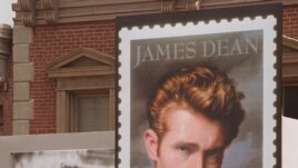 Postal and film industry officials view the unveiling of the new James Dean stamp at a ceremony, June 24, 1996 on the lot where Dean filmed 