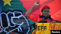 Julius Malema, leader of the Economic Freedom Fighters, gestures as he addresses supporters during the official launch of his political party in Marikana October 13, 2013.