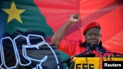 Julius Malema, leader of the Economic Freedom Fighters, gestures as he addresses supporters during the official launch of his political party in Marikana October 13, 2013.