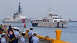 The U.S. Coast Guard National Security Cutter Bertholf (WMSL 750), left, and the Philippine Coast Guard ship BRP Batangas arrive Wednesday, May 15, 2019 in Manila, Philippines, after taking part in a joint exercise off the South China Sea.