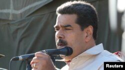 Venezuela's President Nicolas Maduro speaks while he attends a military exercise in Charallave, Venezuela, Feb. 10, 2019. 