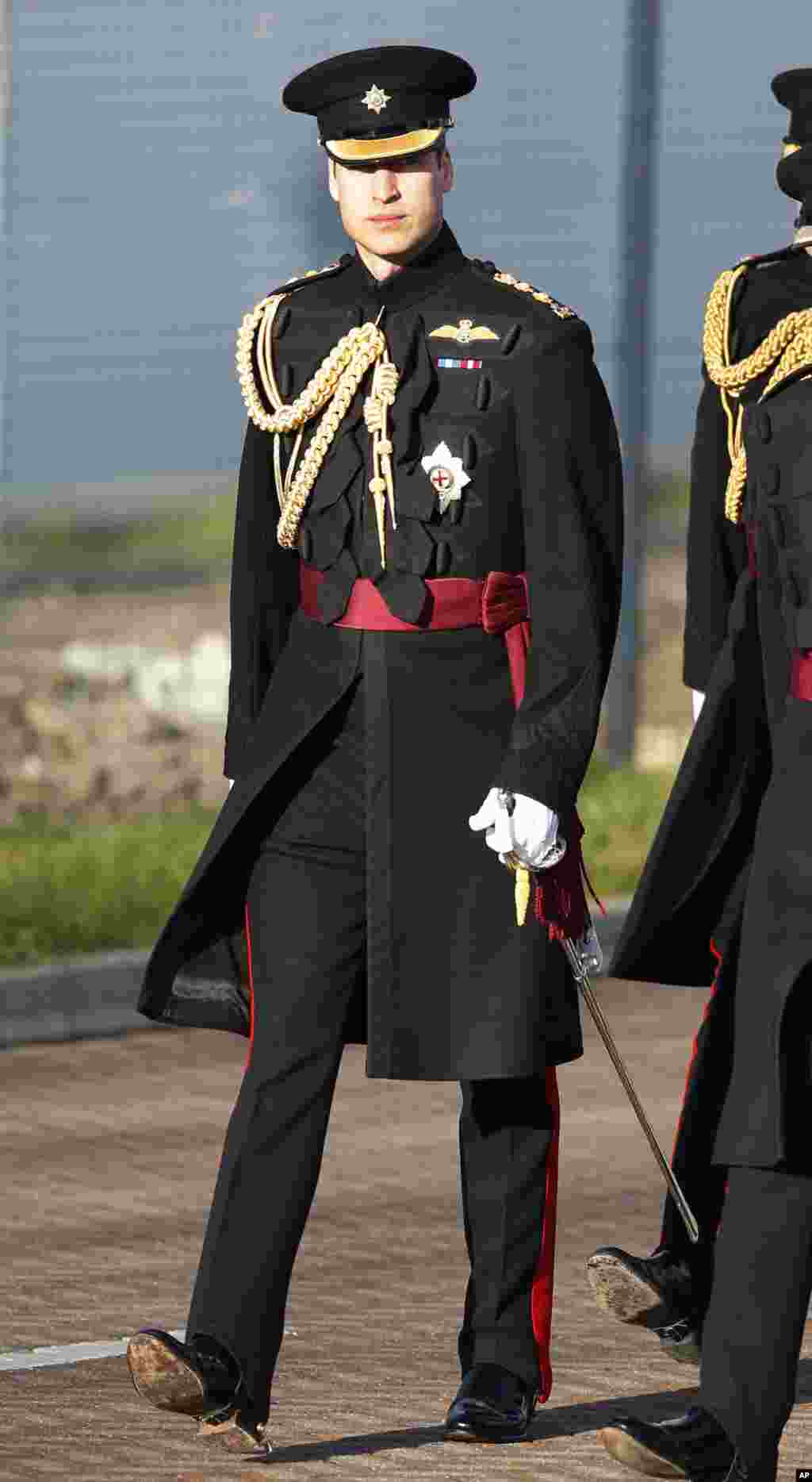 Britain's Prince William arrives at an army base in Aldershot, England, for a ceremony of presentation of operational service medals for service in Afghanistan to No2 Company of the 1st Battalion Irish Guards.