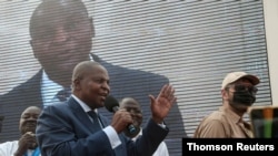 President Faustin-Archange Touadera greets supporters after highest court confirmed his re-election at his party headquarter in Bangui.