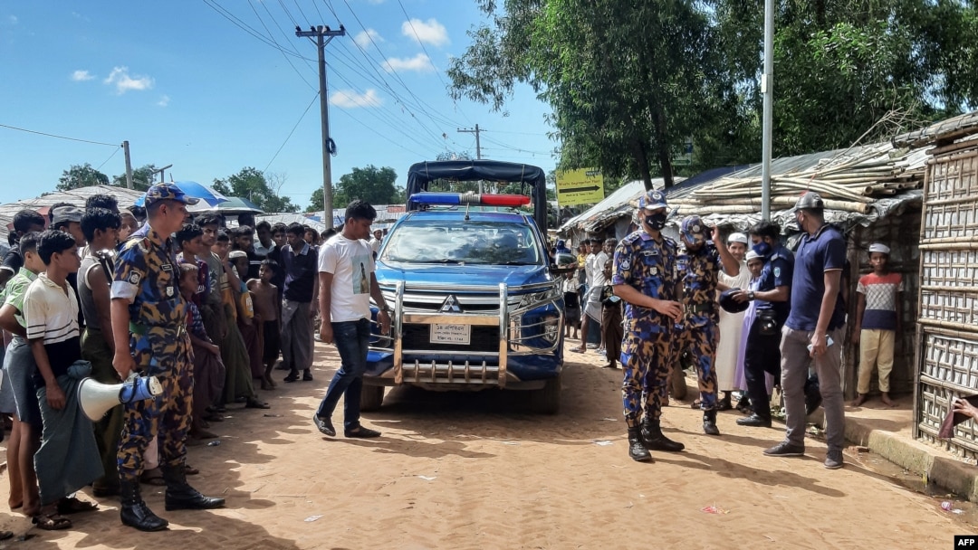 Law enforcement personnel arrive at Kitupalong Refugee camp in Ukhia on Sept. 30, 2021, a day after an unidentified assailant shot dead refugee leader Mohib Ullaha outside his office in a refugee camp.