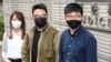 Nga e majta, Agnes Chow, Ivan Lam dhe Joshua Wong mbërrijnë për seancën gjyqësore