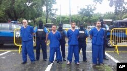 FILE - In this photo provided by the Nicaraguan National Police, prisoners detained and imprisoned during uprisings against the government of President Daniel Ortega, are shown to the press in Managua, Oct. 17, 2018.